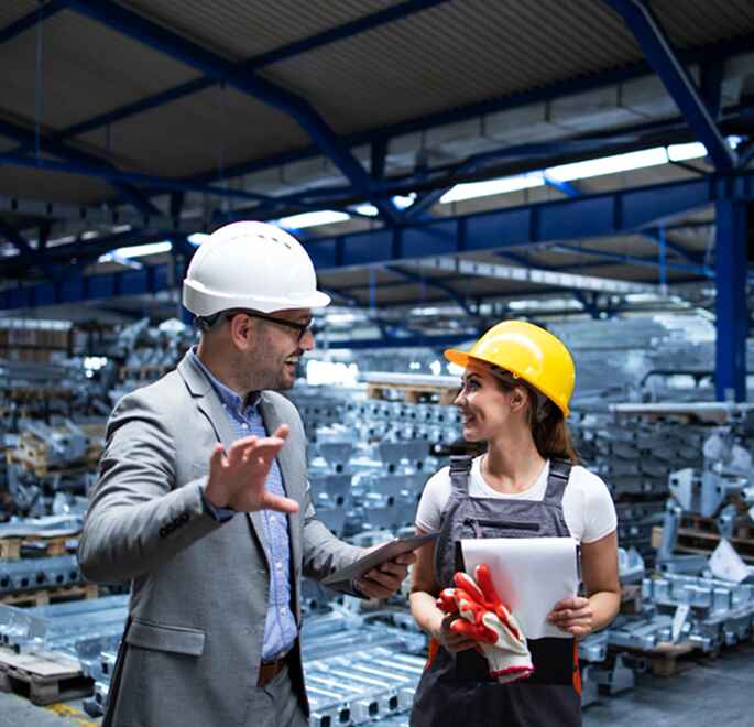 Skilled industrial workers collaborating in a manufacturing facility